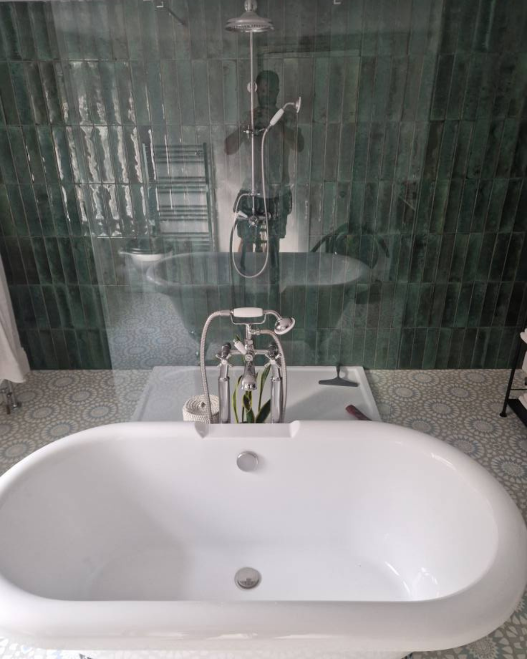 A free standing bath tub and shower installed by J.R.O Home Renovations