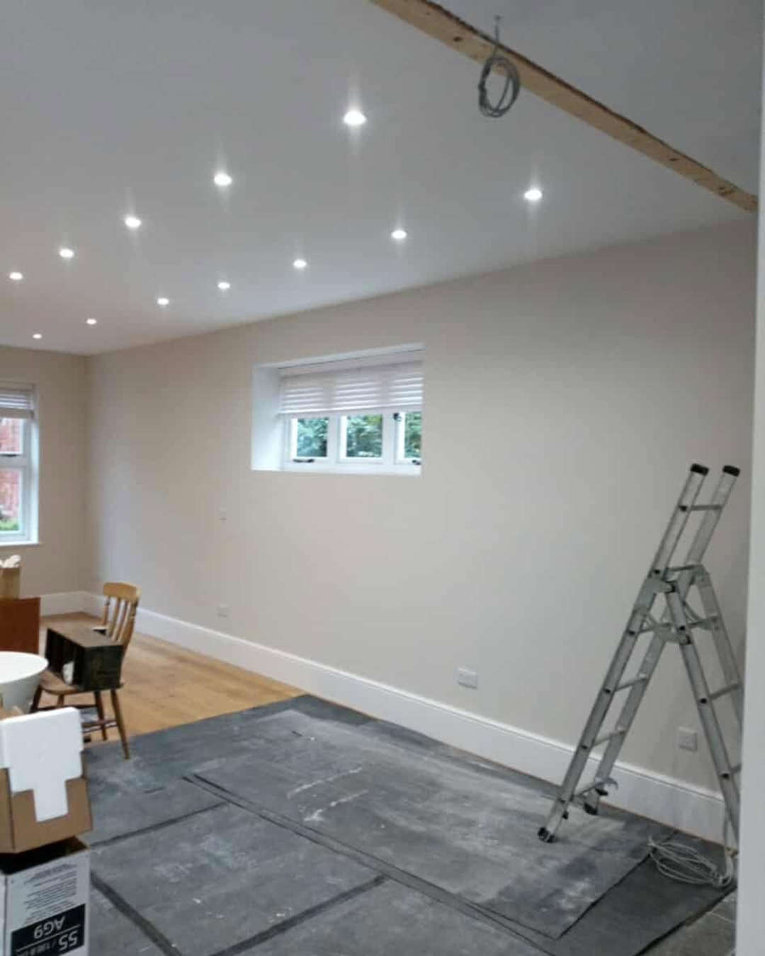 Painting and Decorating work with lights installed in the ceiling