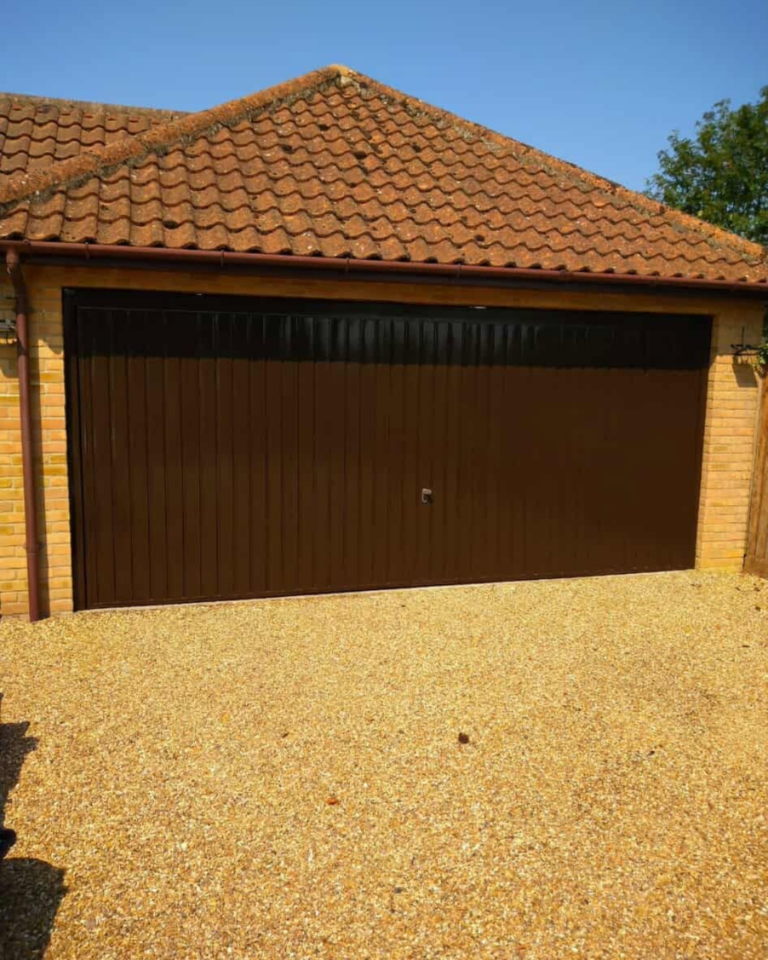 Professionally resprayed brown garage door