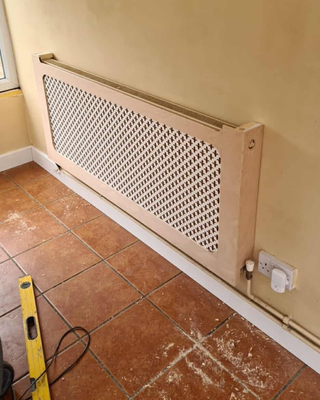 A custom made wooden radiator cover
