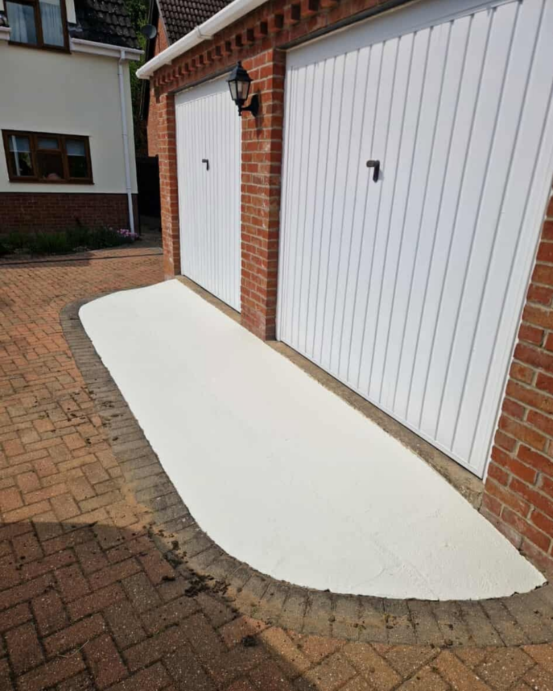 Professionally resprayed white garage doors