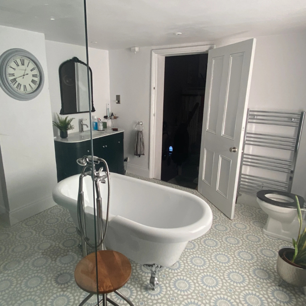 A new bathroom with free standing bath as part of an installation by J.R.O Home Renovations