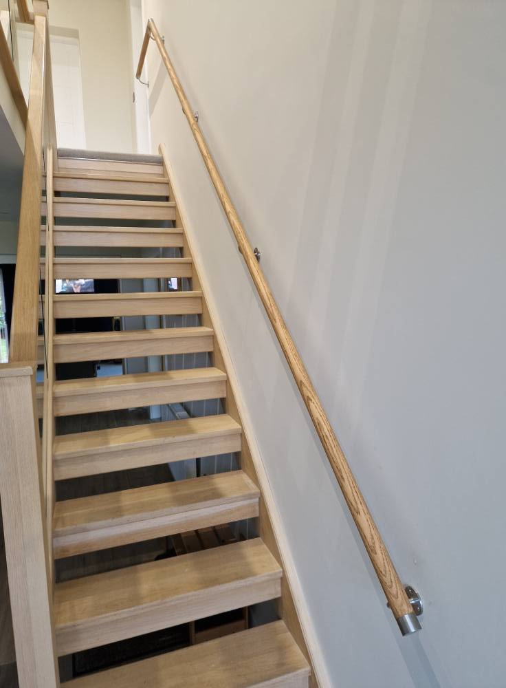 A modern stairway with hand rail